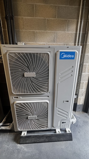Large twin-fan commercial air conditioning outdoor unit