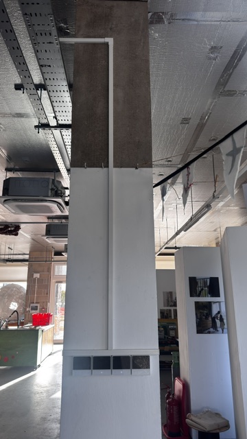 Air conditioning cable trunking neatly run down a concrete column